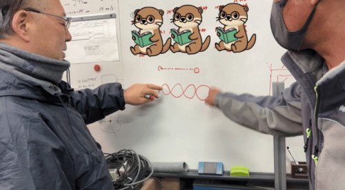 Laser cleaning technical discussion with client using whiteboard